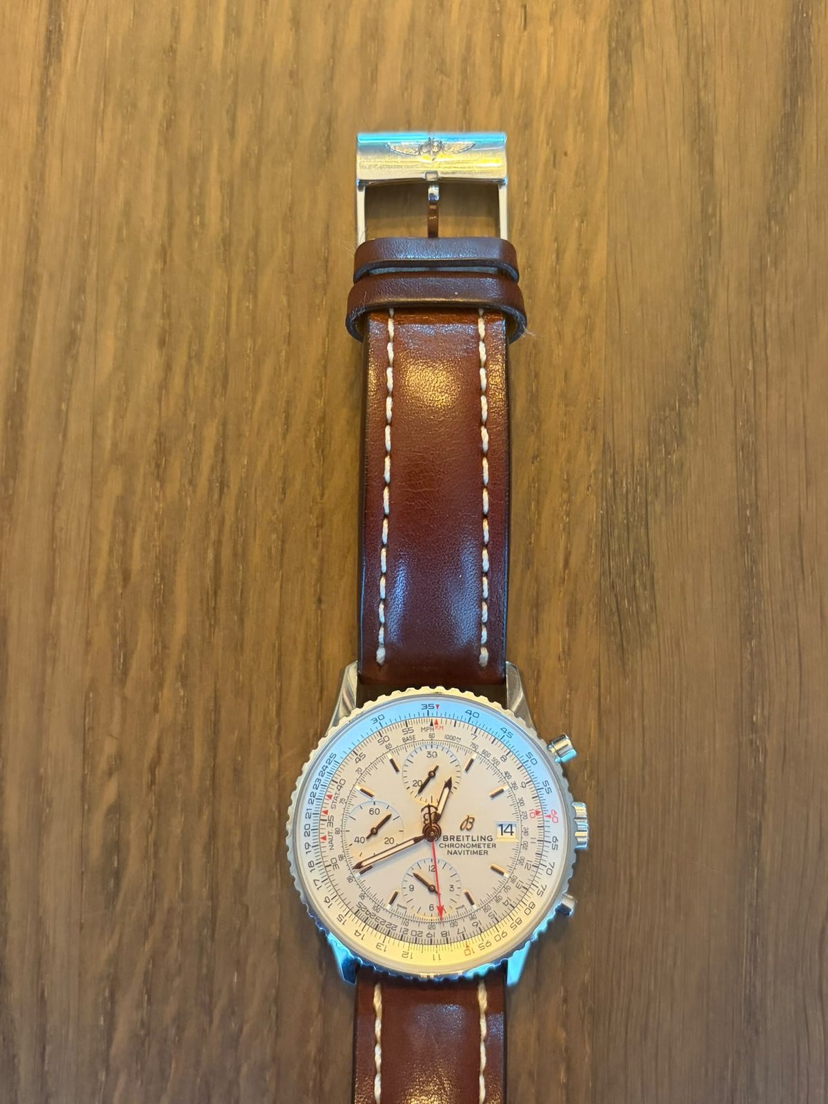 Breitling Navitimer Chronograph 41 — case and crown detail with brown leather strap and cream dial