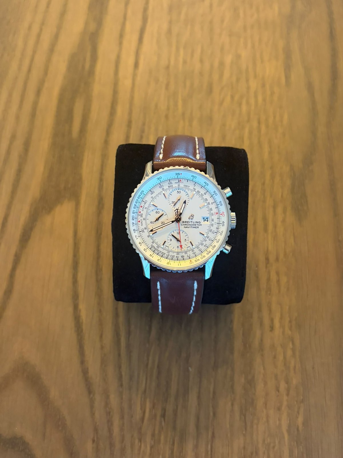 Breitling Navitimer Chronograph 41 — displayed on a black watch stand showing the full case and dial