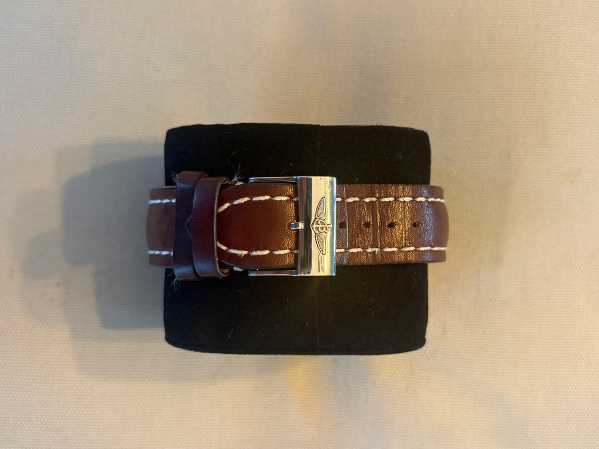 Breitling calfskin leather strap with stainless steel pin buckle bearing the Breitling logo